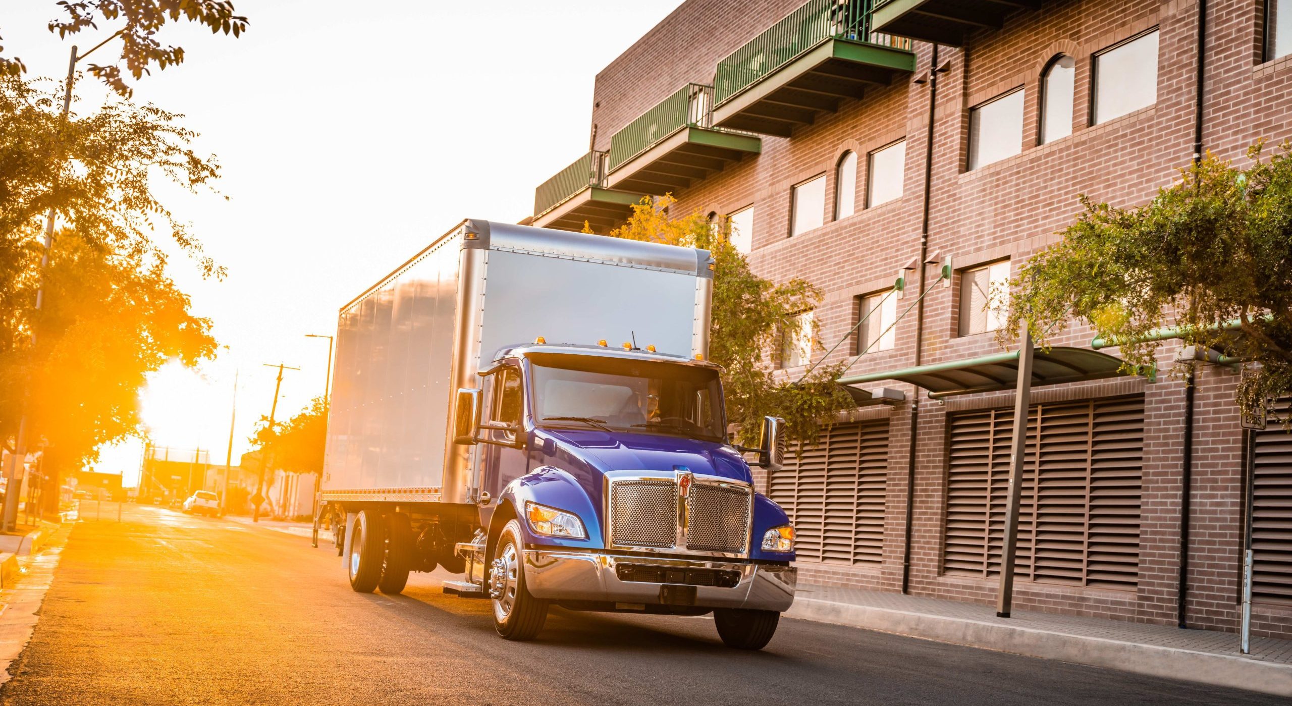 Kenworth Truck Driving Down The Road